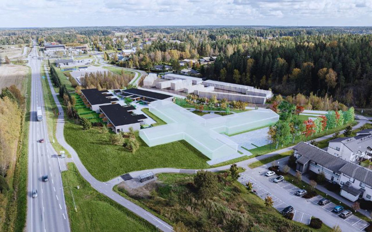 Ilmakuva suunnitellusta rivitalosta visualisointikuva istutettu kuvaan.